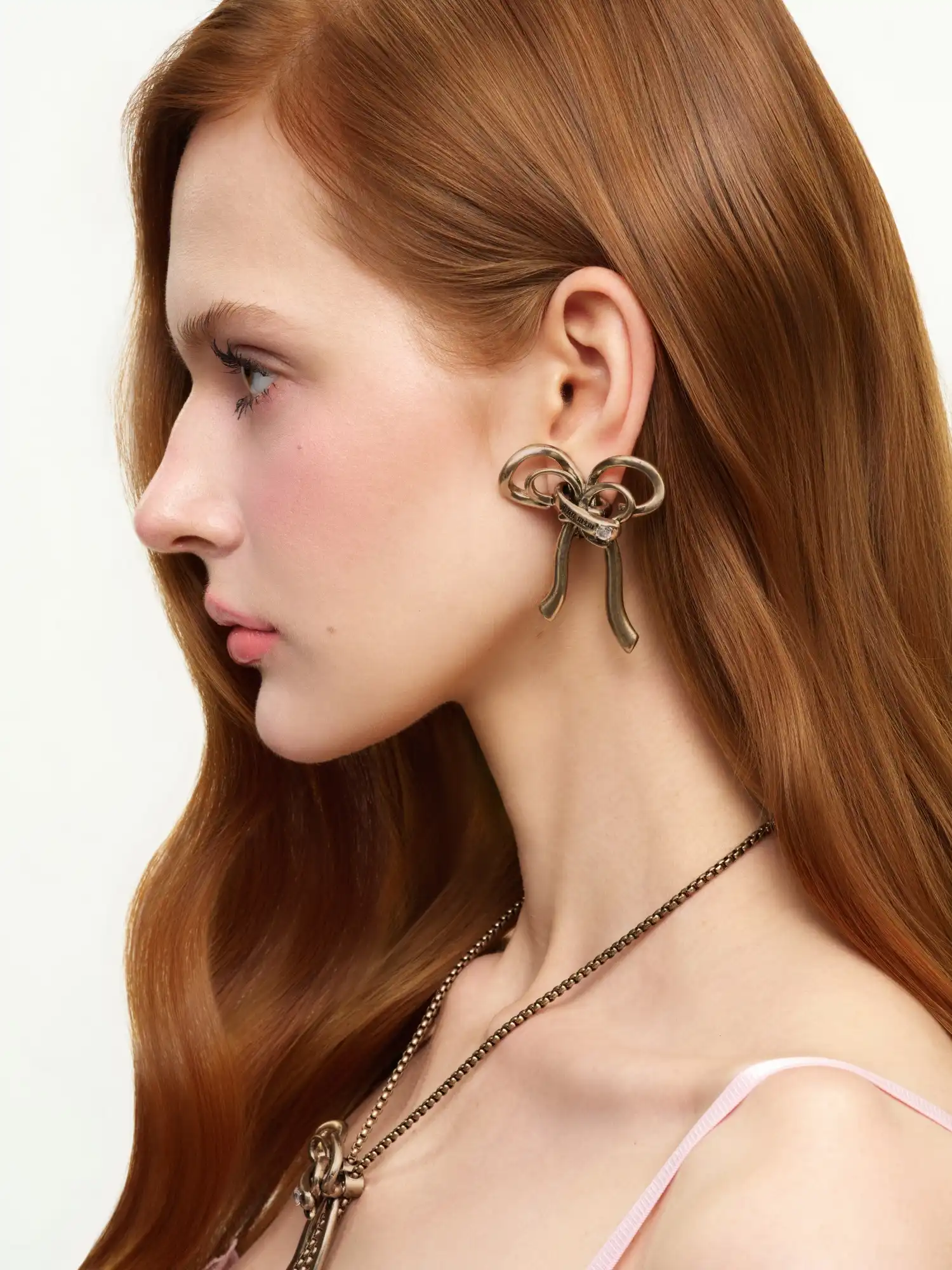 Antiqued Sculptural Bow Statement Earrings - Image 4